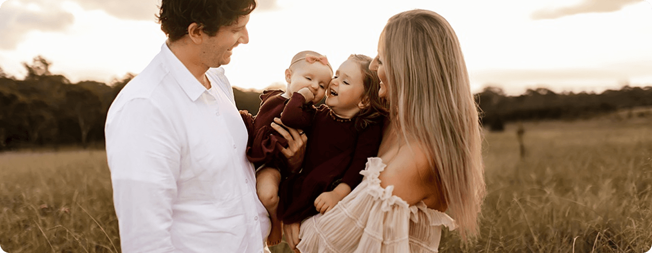 Happy family with children in outdoor setting